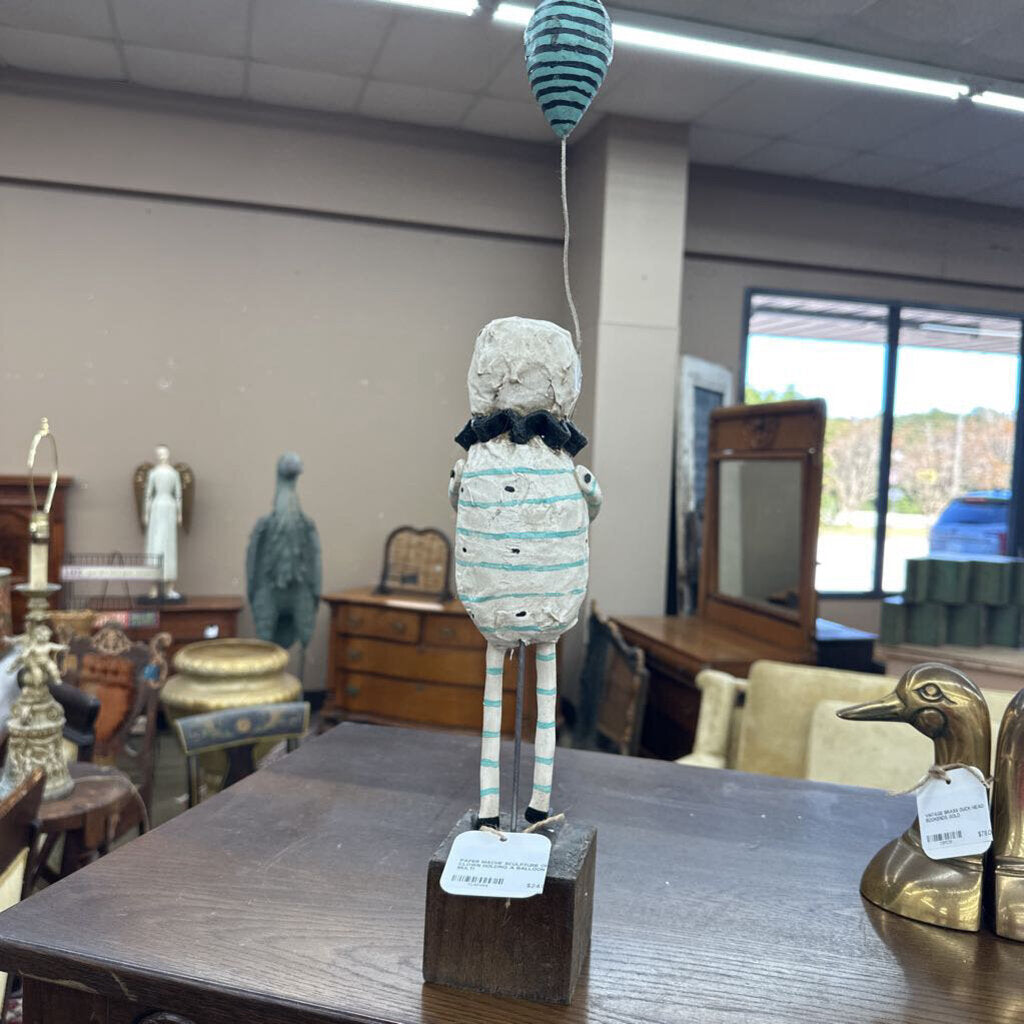 PAPER MACHE SCULPTURE OF CLOWN HOLDING A BALLOON