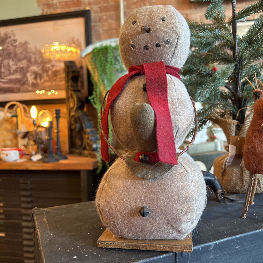 SNOWMAN ON STAND WITH HAT IN HANDS