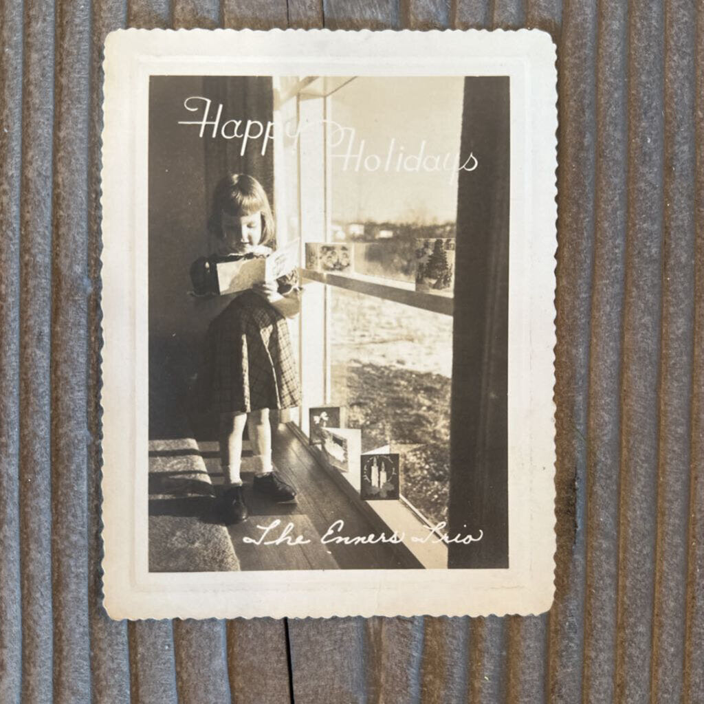 HOLIDAY CARD WITH GIRL READING BY WINDOW