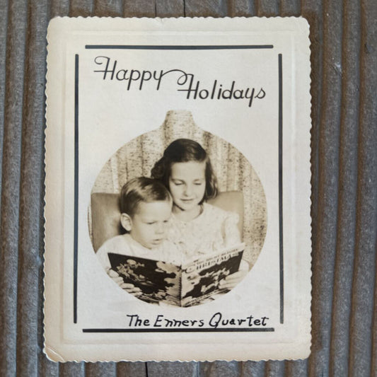 HOLIDAY CARD WITH BOY AND GIRL READING BOOK