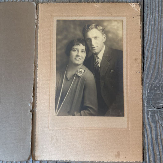 PHOTO OF COUPLE WITH WOMAN IN PEARLS