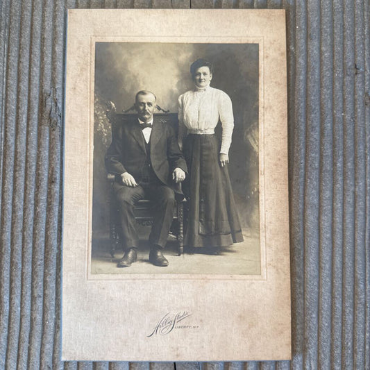 PHOTO CARD OF COUPLE WITH MAN SEATED