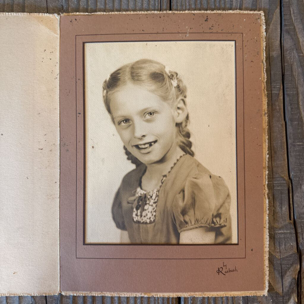 SCHOOL PHOTO OF YOUNG GIRL WITH BRAIDS