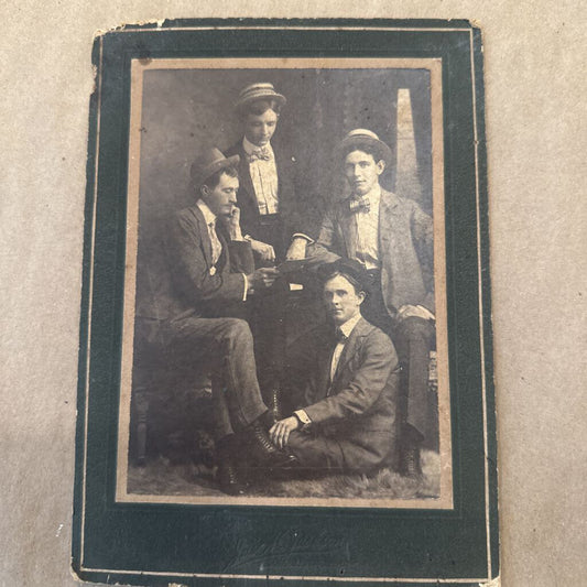 PHOTO OF FOUR MEN