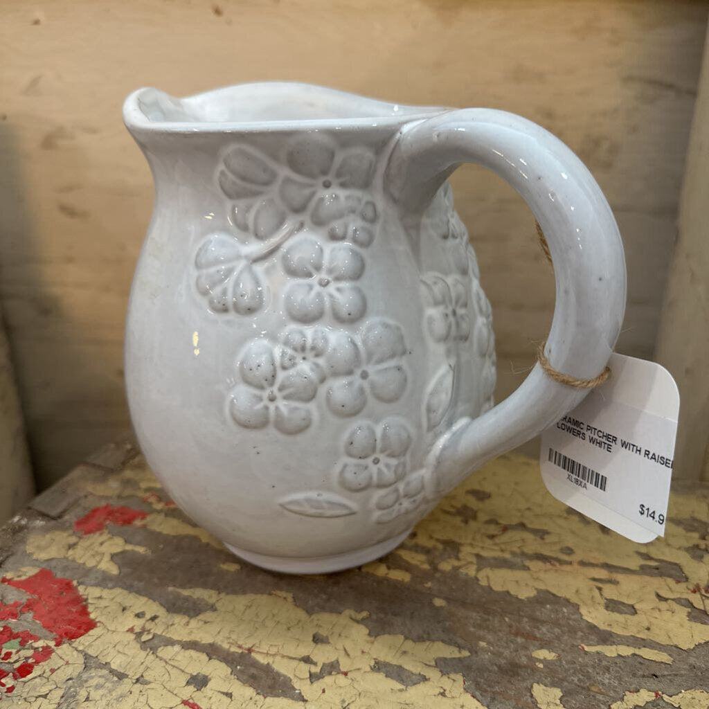 CERAMIC PITCHER WITH RAISED FLOWERS