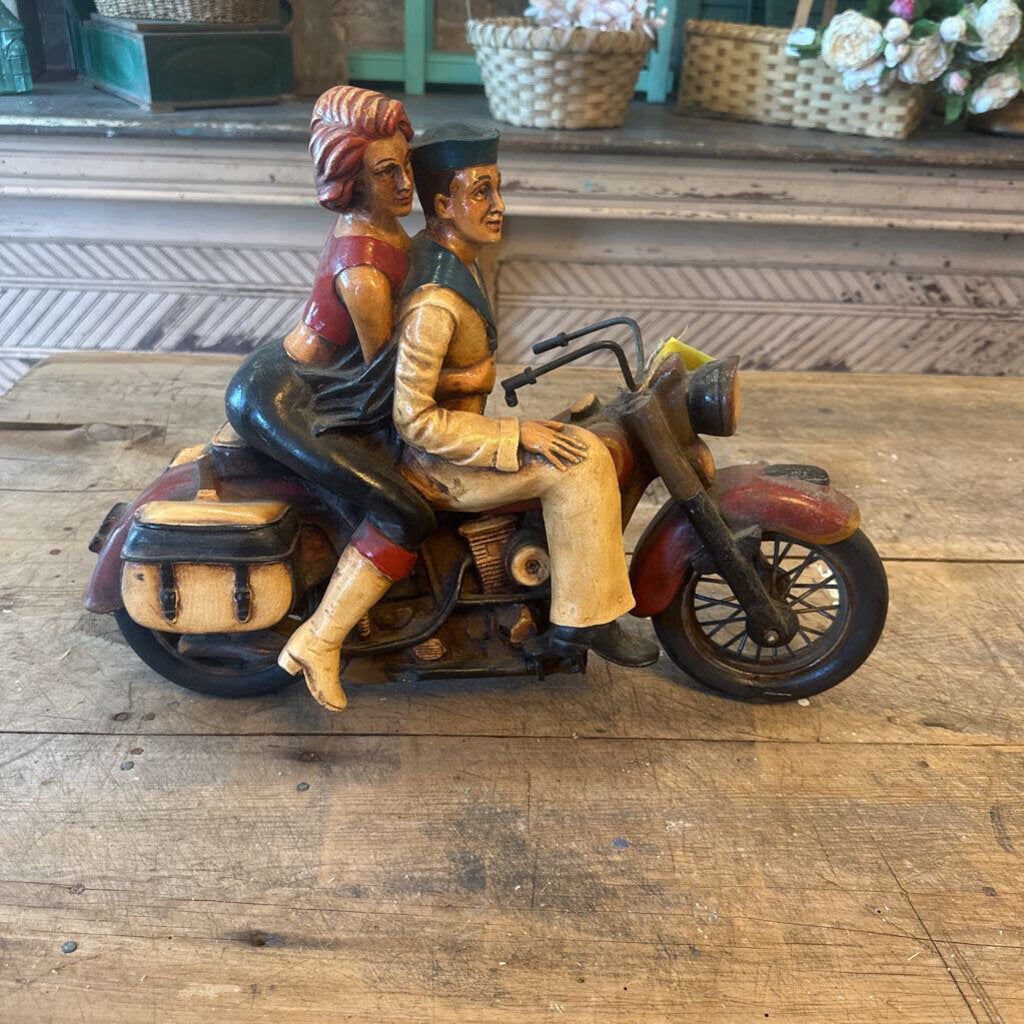 STATUE OF COUPLE ON A MOTORCYCLE