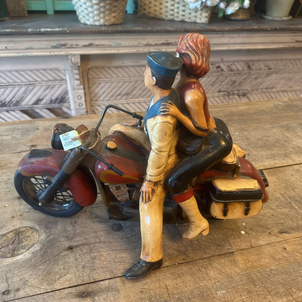 STATUE OF COUPLE ON A MOTORCYCLE