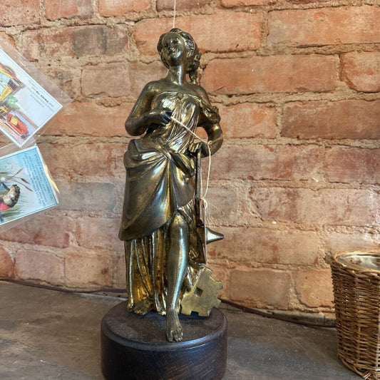 BRONZE STATUE OF A WOMAN