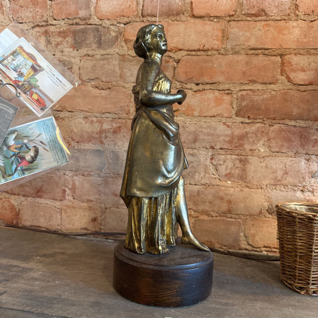 BRONZE STATUE OF A WOMAN