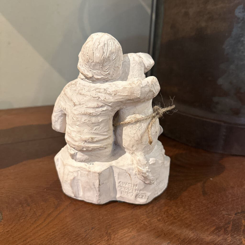 STATUE OF BOY WITH DOG