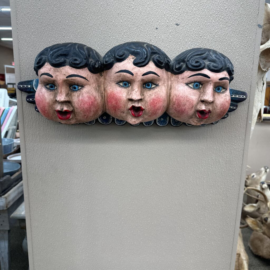 PAINTED PAPER MACHE MOLD OF THREE CHERUB FACES