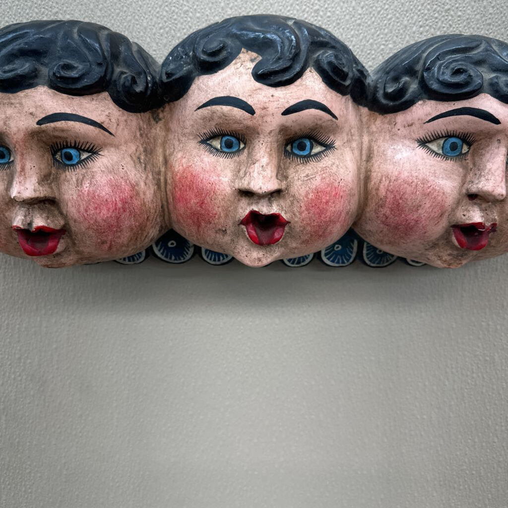 PAINTED PAPER MACHE MOLD OF THREE CHERUB FACES